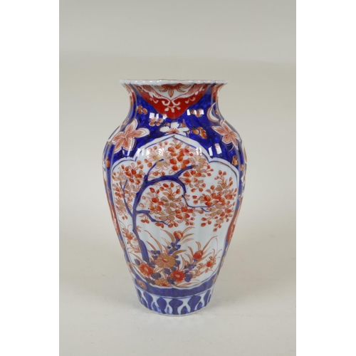 297 - A C19th Japanese Imari porcelain ribbed vase with decorative floral panels, 24cm high, and a Japanes... 