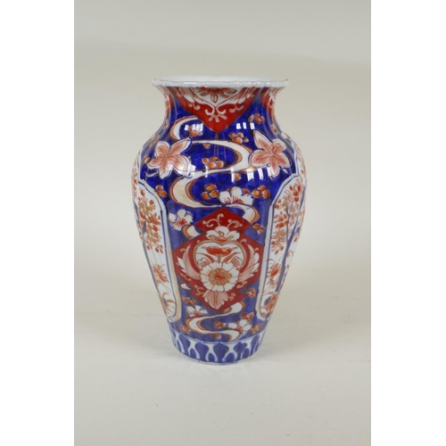 297 - A C19th Japanese Imari porcelain ribbed vase with decorative floral panels, 24cm high, and a Japanes... 