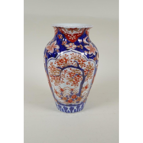 297 - A C19th Japanese Imari porcelain ribbed vase with decorative floral panels, 24cm high, and a Japanes... 