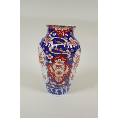 297 - A C19th Japanese Imari porcelain ribbed vase with decorative floral panels, 24cm high, and a Japanes... 