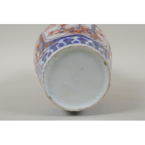 297 - A C19th Japanese Imari porcelain ribbed vase with decorative floral panels, 24cm high, and a Japanes... 