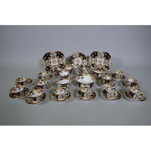 3 - A Staffordshire Imari pattern six place tea set, with twelve spare cups, 42 pieces