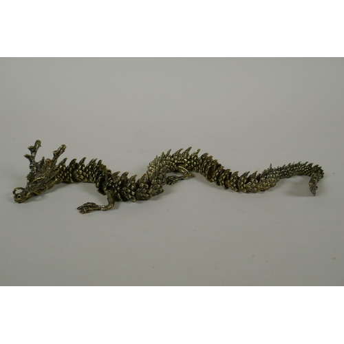 30 - A Japanese Jizai style bronze okimono dragon with articulated body and limbs, 42cm long