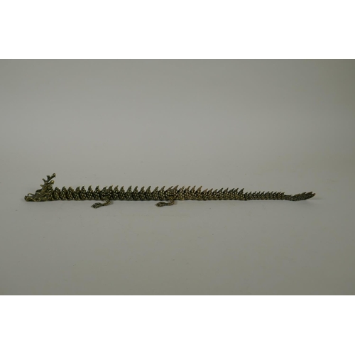 30 - A Japanese Jizai style bronze okimono dragon with articulated body and limbs, 42cm long