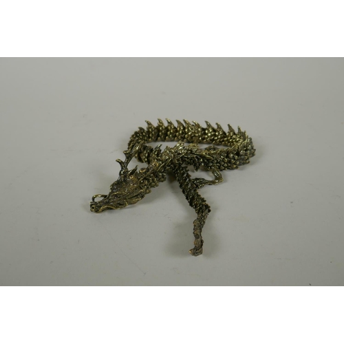 30 - A Japanese Jizai style bronze okimono dragon with articulated body and limbs, 42cm long