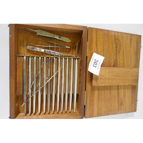 303 - A wood case stamped Weiss & Son, London, containing surgical instruments, and another fold out c... 