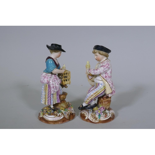 36 - A pair of Continental hard paste porcelain figures, boy with a bird and a birdseller, factory mark t... 