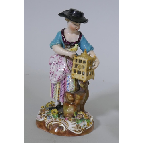 36 - A pair of Continental hard paste porcelain figures, boy with a bird and a birdseller, factory mark t... 