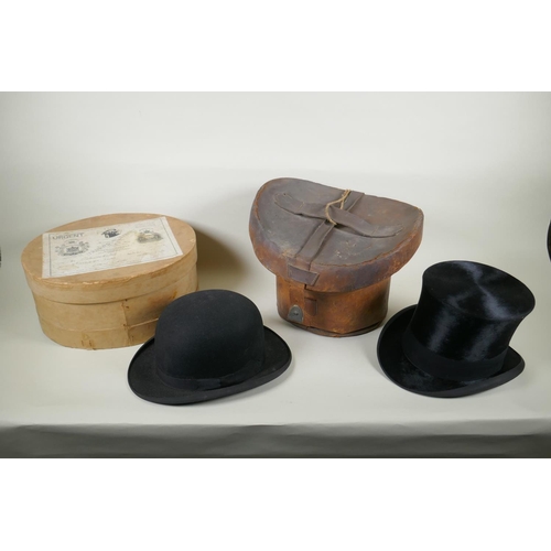 41 - A vintage G.A. Dunn & Co bowler hat, a vintage silk top hat, an antique leather top hat case and... 