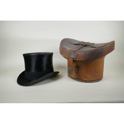 41 - A vintage G.A. Dunn & Co bowler hat, a vintage silk top hat, an antique leather top hat case and... 