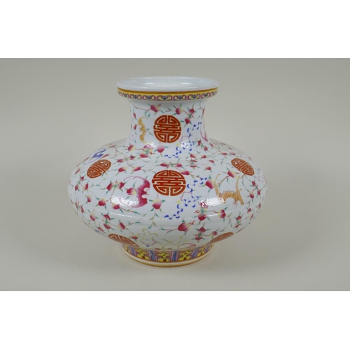 45 - A Chinese polychrome porcelain vase of squat form, decorated with peaches, bats and auspicious symbo... 