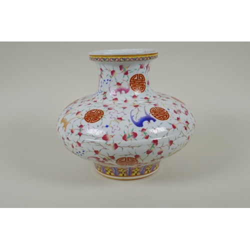 45 - A Chinese polychrome porcelain vase of squat form, decorated with peaches, bats and auspicious symbo... 