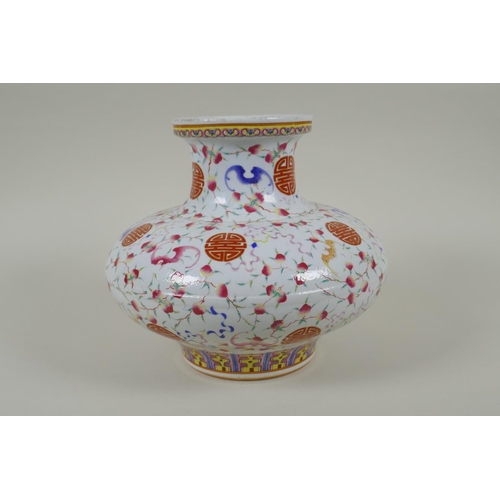 45 - A Chinese polychrome porcelain vase of squat form, decorated with peaches, bats and auspicious symbo... 