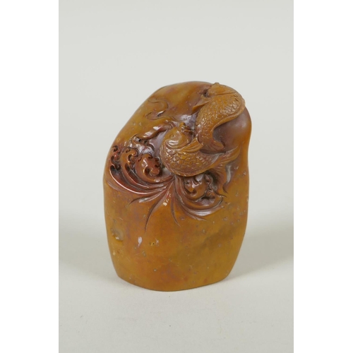 48 - A Chinese carved soapstone seal decorated with carp, 7cm high