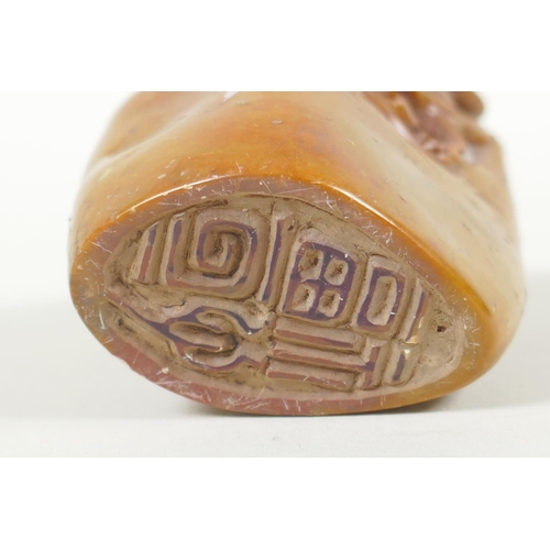 48 - A Chinese carved soapstone seal decorated with carp, 7cm high