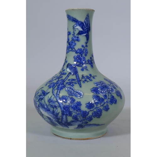 5 - A Chinese celadon glazed vase with raised blue and white decoration of birds and bats, C19th/C20th, ... 