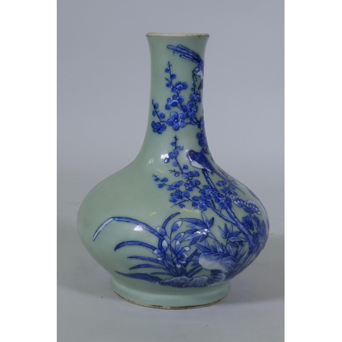 5 - A Chinese celadon glazed vase with raised blue and white decoration of birds and bats, C19th/C20th, ... 