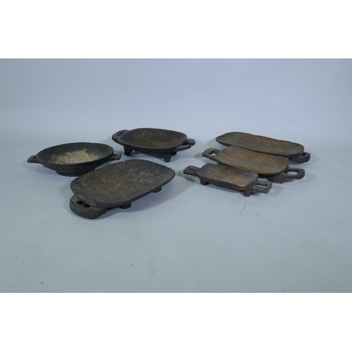 57 - A collection of six South African Zulu wood meat platters, largest 44cm long