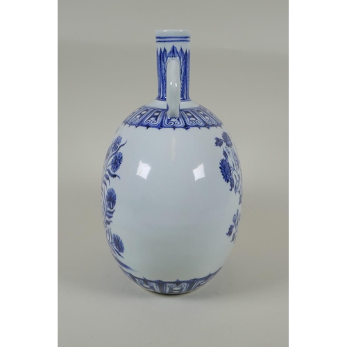 60 - A Chinese blue and white porcelain moon flask with two handles and floral decoration, 4 character ma... 