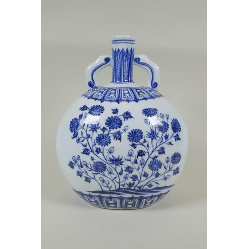 60 - A Chinese blue and white porcelain moon flask with two handles and floral decoration, 4 character ma... 