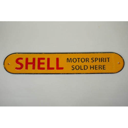 62 - A 'Shell Motor Sport' painted cast iron wall plaque, 50cm long