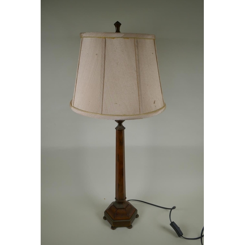 66 - A grained wood and brass hexagonal column table lamp, 80cm high