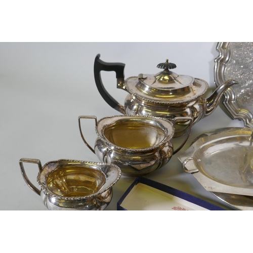 669 - A quantity of silver plate to include tea sets, serving trays, coasters, goblets etc