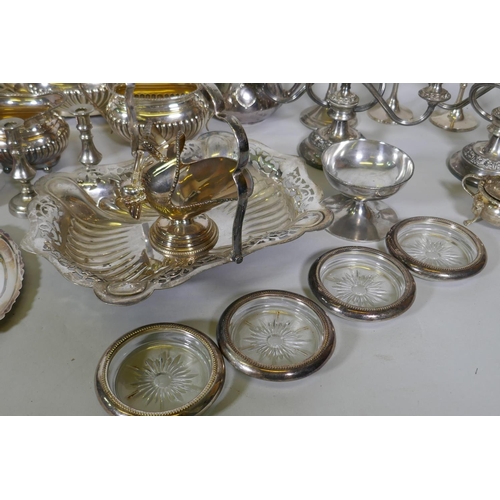 669 - A quantity of silver plate to include tea sets, serving trays, coasters, goblets etc