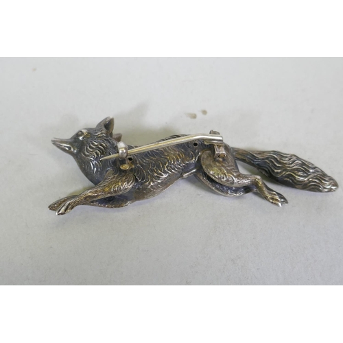 670 - A vintage silver fox brooch, unmarked, 6cm long, an Indian brooch miniature on mother of pearl depic... 