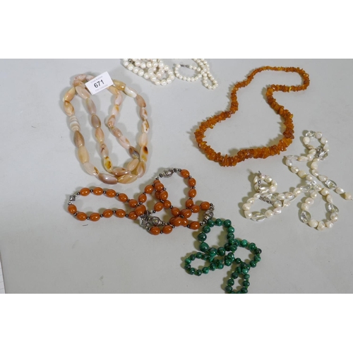 671 - A string of natural amber, agate and pearls, malachite etc