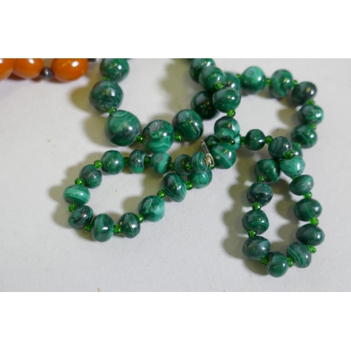 671 - A string of natural amber, agate and pearls, malachite etc