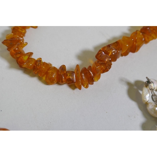 671 - A string of natural amber, agate and pearls, malachite etc