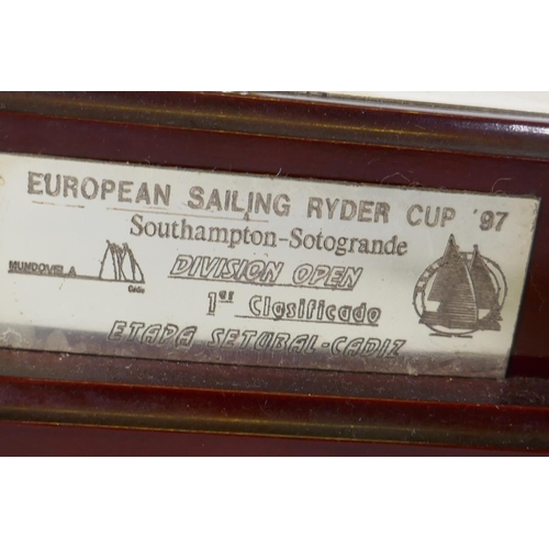 675 - A silver plated sailing trophy, the three ships of Columbus, on a wood base, 43 x 15 x 26cm