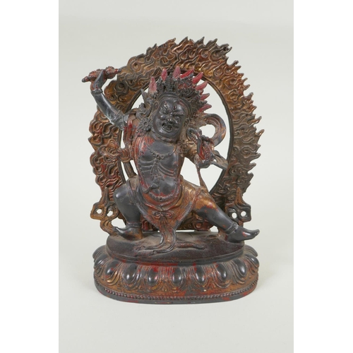 70 - A Tibetan bronze figure of Vajrapani with remnants of gilt patina, 24cm high