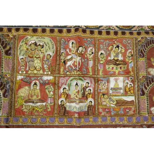 74 - An antique Tibetan embroidered and beaded silk textile hanging, decorated with depictions of Buddha,... 