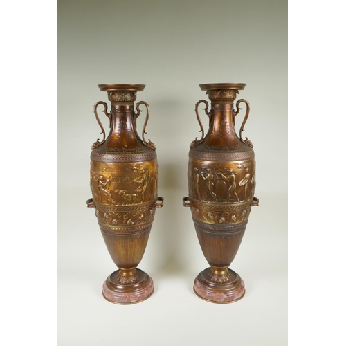 77 - After Barbedienne, a pair of bronze Grand Tour style urns with two handles and raised figural decora... 