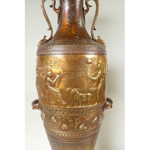 77 - After Barbedienne, a pair of bronze Grand Tour style urns with two handles and raised figural decora... 