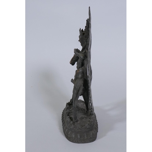 80 - A Sino-Tibetan bronze figure of a deity on horseback, 32cm high