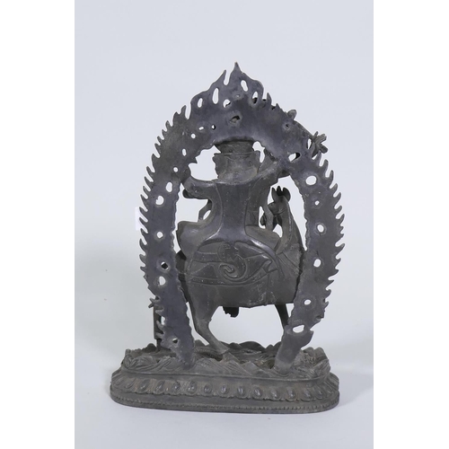 80 - A Sino-Tibetan bronze figure of a deity on horseback, 32cm high