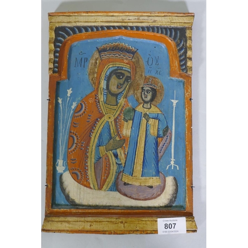 807 - An orthodox Greek icon of the Theotokos, oil and silver leaf on poplar panel, inscribed verso, publi... 