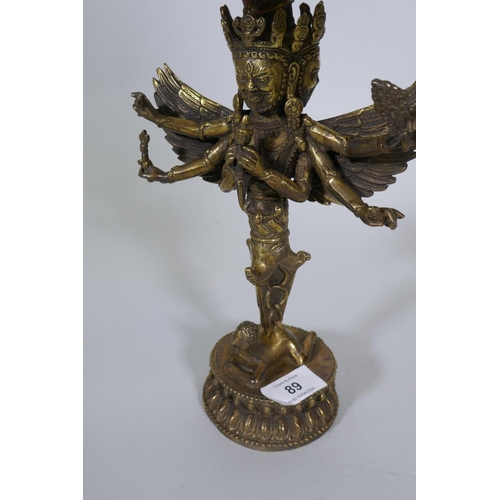 89 - A yellow metal phurba figure, AF, for repair, 27cm high