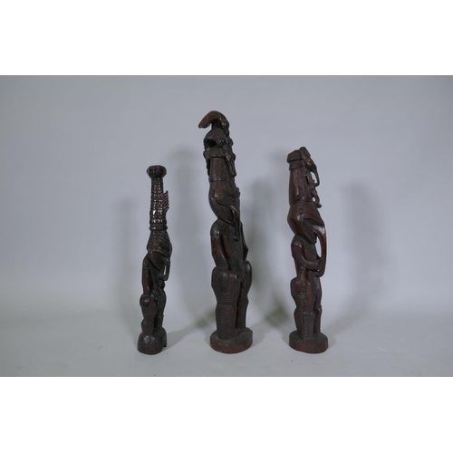 9 - Three Papua New Guinea carved wood tribal figures, largest 64cm high