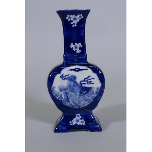 96 - A Chinese blue and white vase with kylin and prunus blossom decoration, 24cm high