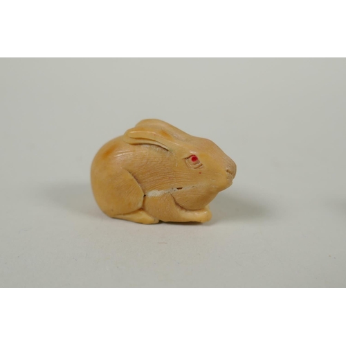 97 - Five Japanese carved tagua nut netsuke in the form of hares, a buffalo and a Buddha, largest 4cm