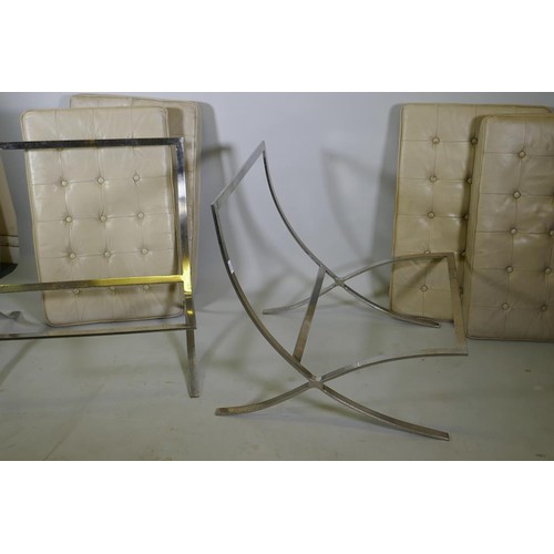 1070 - A pair of Barcelona style chairs, chromed steel frames and leather cushions, lack webbing