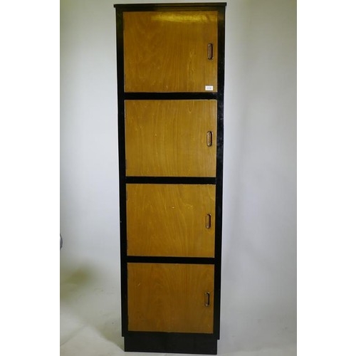 1115 - A bespoke mid-century cherry wood and black lacquer media cabinet of four cupboards, 56 x 49 x 193cm