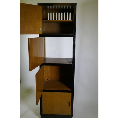 1115 - A bespoke mid-century cherry wood and black lacquer media cabinet of four cupboards, 56 x 49 x 193cm