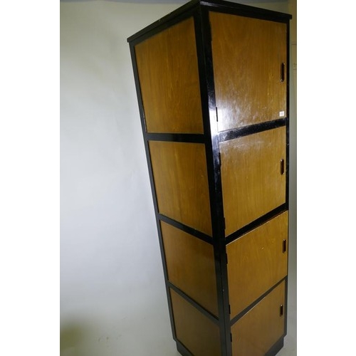 1115 - A bespoke mid-century cherry wood and black lacquer media cabinet of four cupboards, 56 x 49 x 193cm