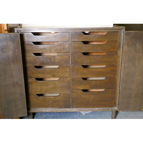 1116 - A mid-century cherry wood press cupboard, the two folding drawers opening to reveal twelve slide dra... 