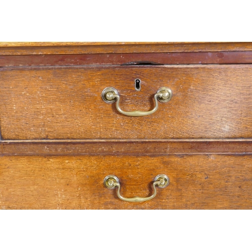 1199 - A Georgian oak chest of two over three drawers, mahogany banded top, cockbeaded drawers with origina... 